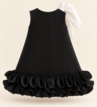 Girls Black Scuba A-Line Party Dress with Oversized White Shoulder Bow & Layered Ruffle Hem
